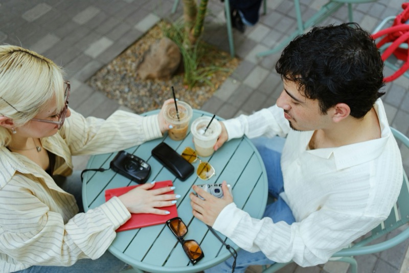Two people talking on a walk outside